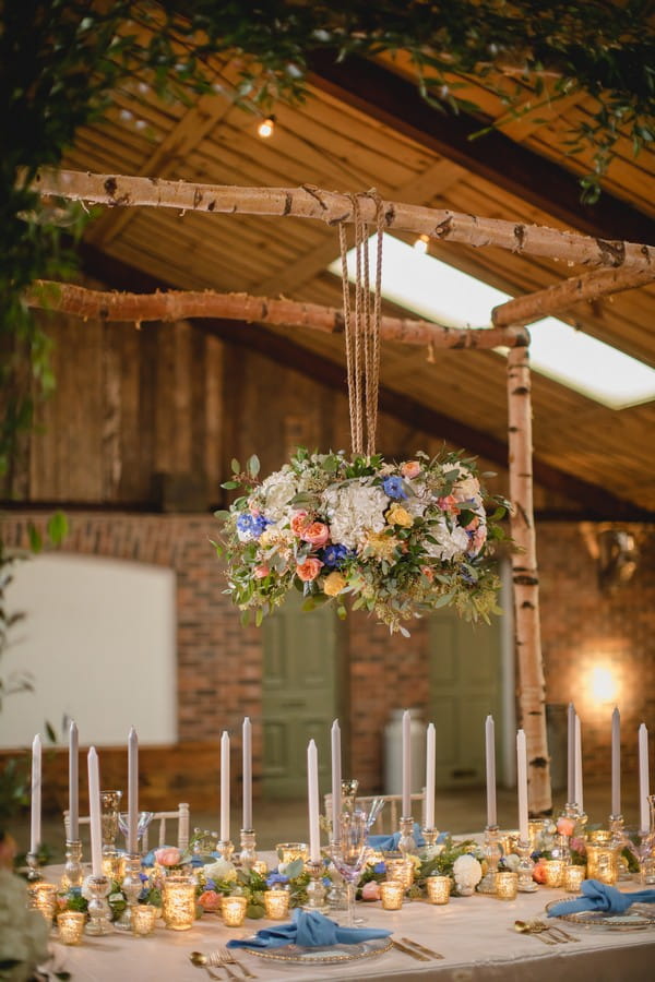 Hanging floral display above wedding table