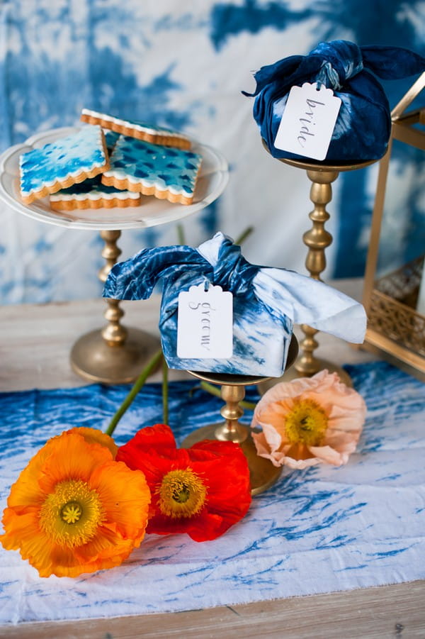 Bright flowers with gold and indigo blue wedding decorations