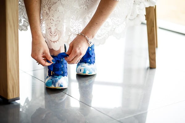 Bride doing up shoes