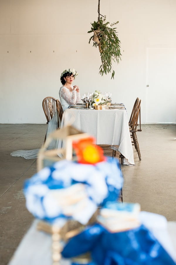 Bride sitting at wedding table