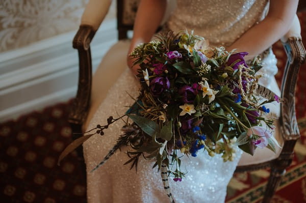 Bride's bouquet with dark flowers and foliage