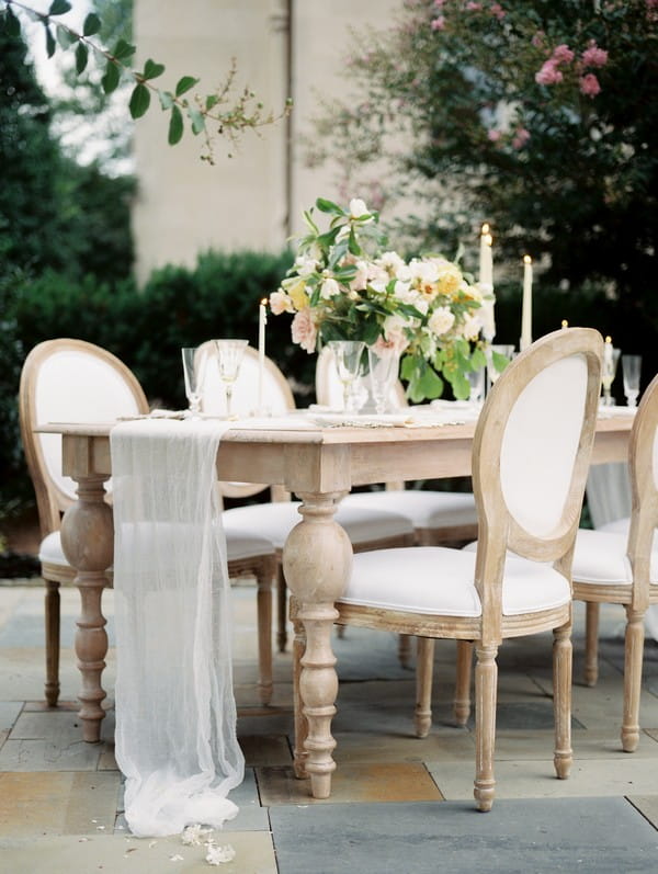 Lace wedding table runner hanging off table