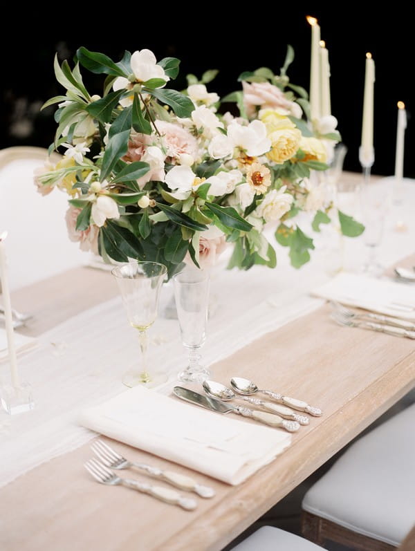 Vase of flowers on wedding table with simple, elegant styling