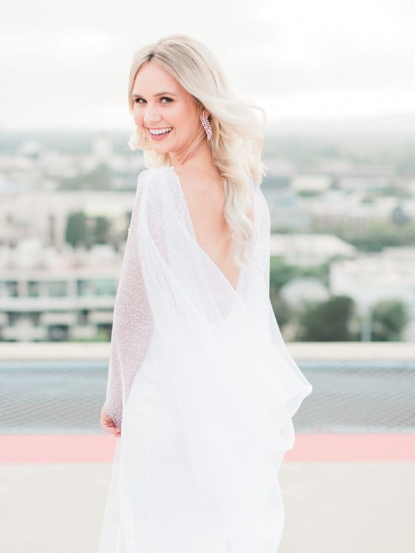 Bride wearing bridal cape