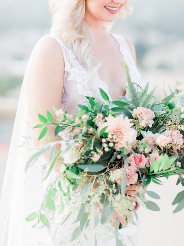 Bridal bouquet of foliage and peach flowers