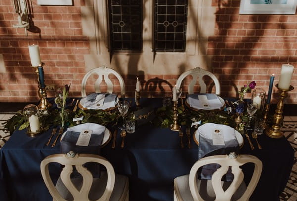 Small wedding table with dark blue tablecloth