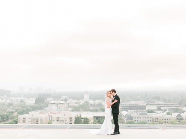 Bride and groom on roof of The Four Seasons in Beverly Hills