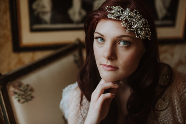 Bride wearing crystal and pearl hairpiece