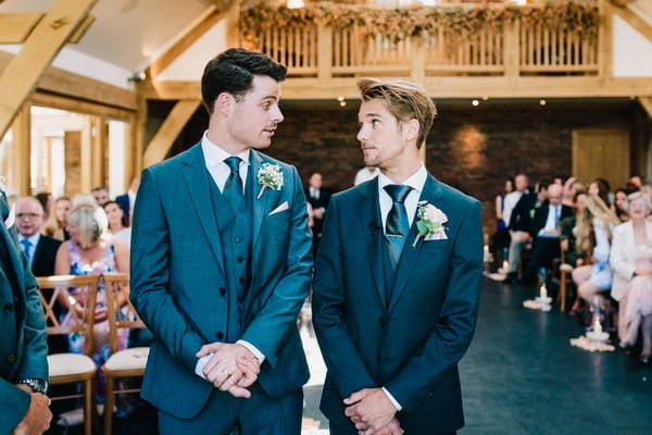 Groom and best man at altar