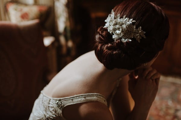 Hairpiece in back of bride's updo hairstyle