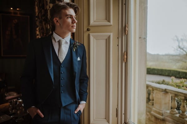 Groom looking out of window at Kilworth House