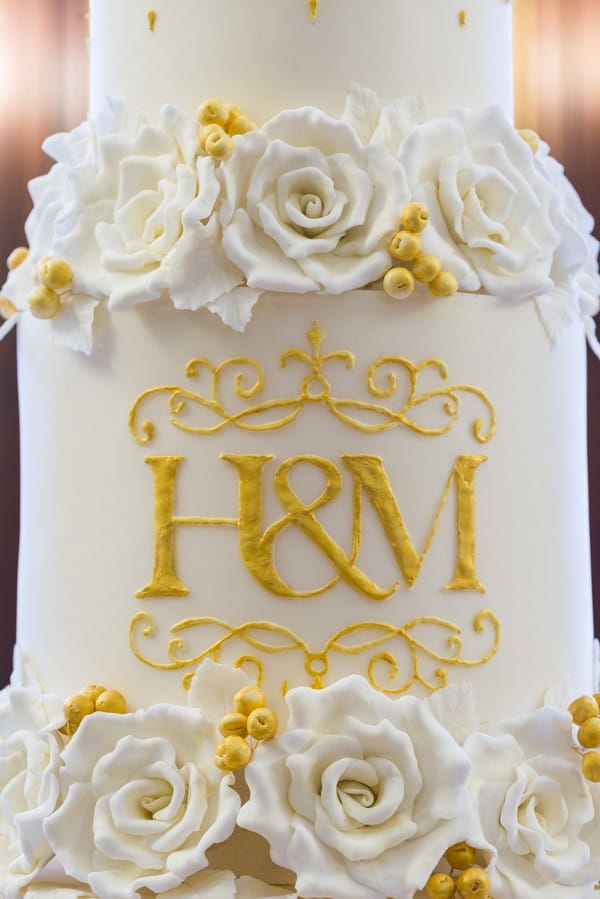 H and M monogram iced on wedding cake