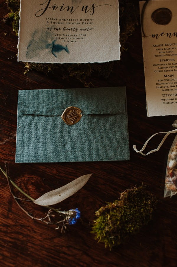 Blue envelope with gold wax seal