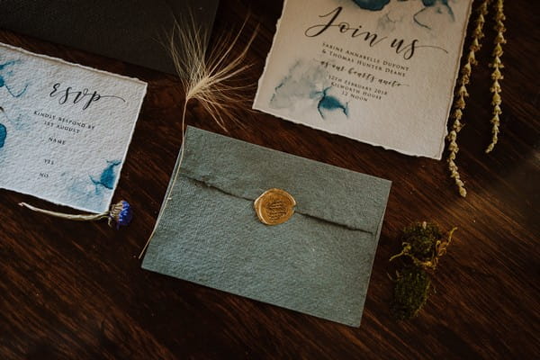 Blue envelope with gold wax seal