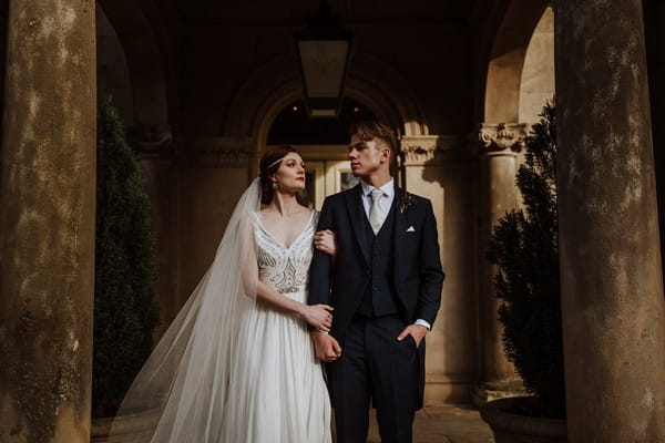 Bride and groom standing at entrance to Kilworth House