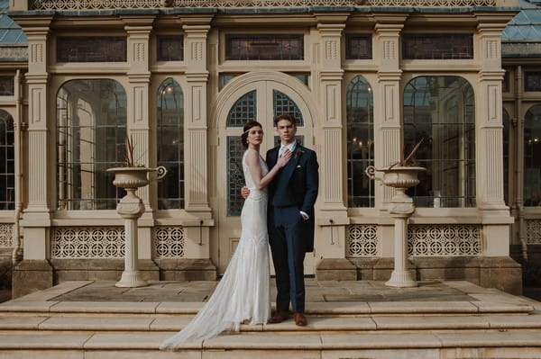 Bride and groom on steps at Kilworth House