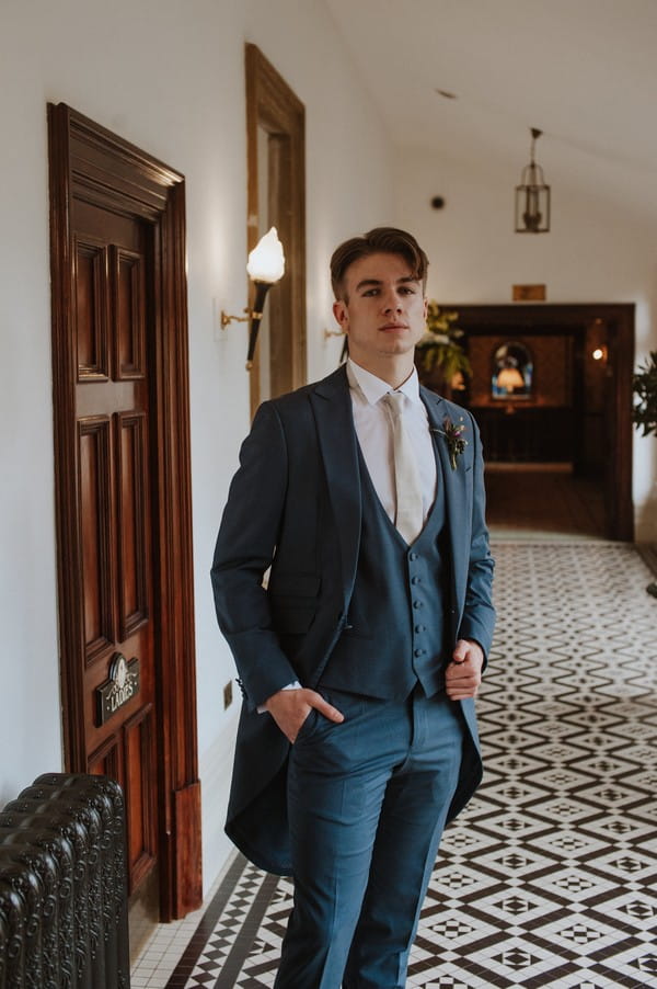 Groom wearing light blue suit