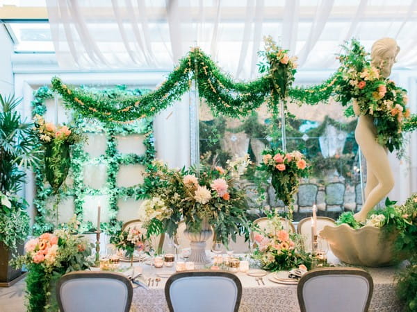 Wedding table with peach flower and foliage wedding styling