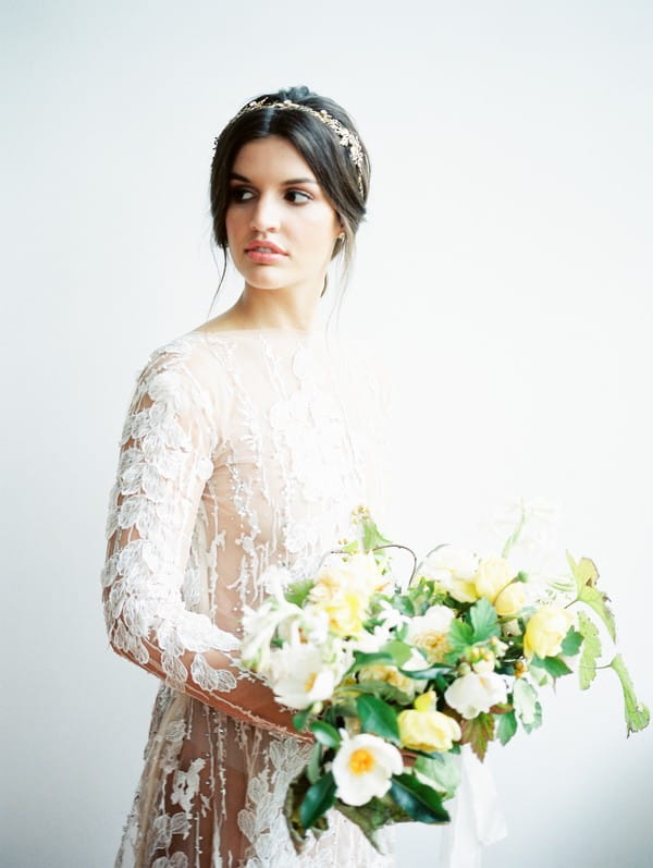 Bride holding yellow wedding bouquet