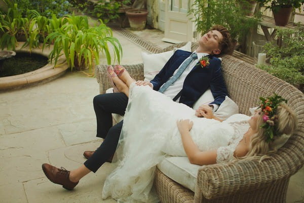 Bride and Groom Relaxing on a Couch