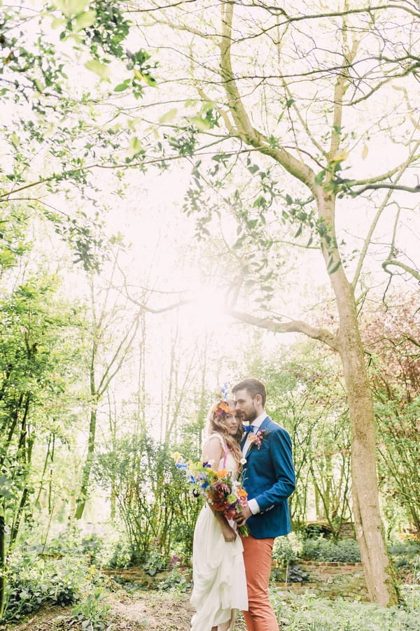 Bride and groom in woodland