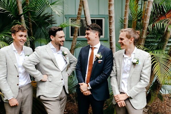 Groom with groomsmen in light grey suits