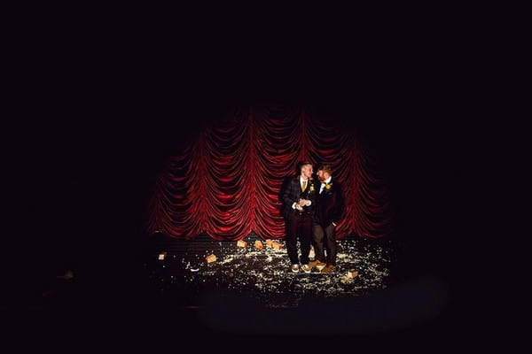 Two grooms on stage under spotlight - Picture by Daz Mack