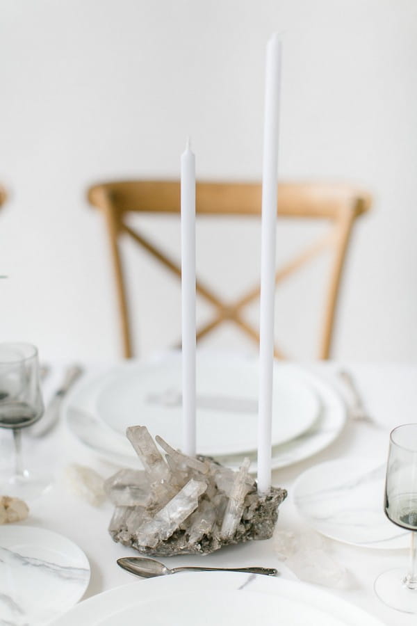 Long white candle in crystal