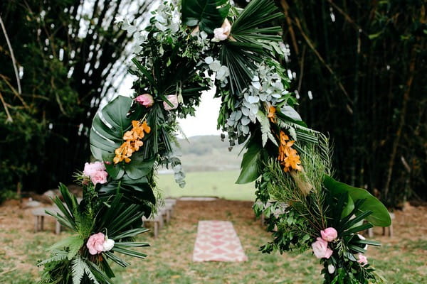 Wedding ceremony arch and rug