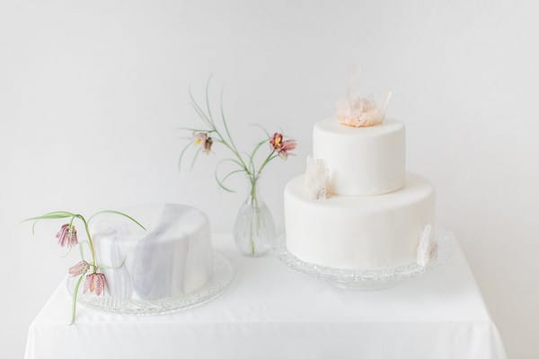 Grey marble and plain white wedding cakes