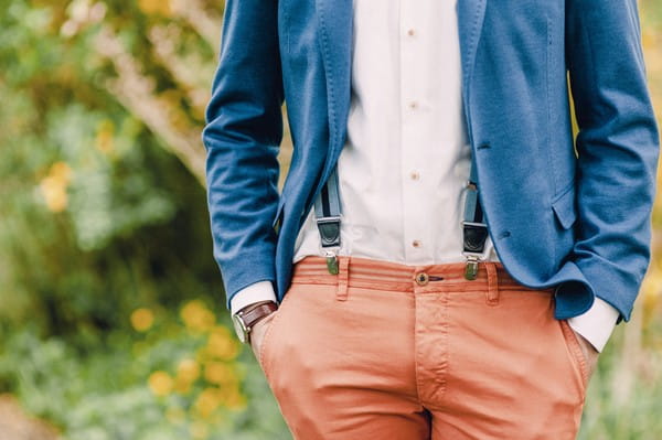 Groom's blue jacket and coral trousers