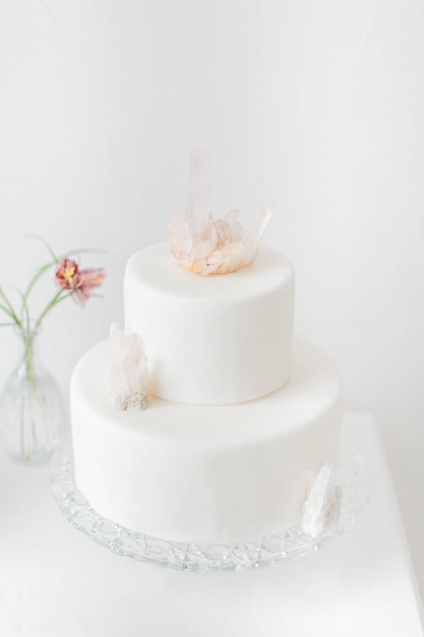 White wedding cake with crystal cake topper