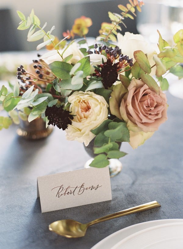 Antique toned wedding table flowers