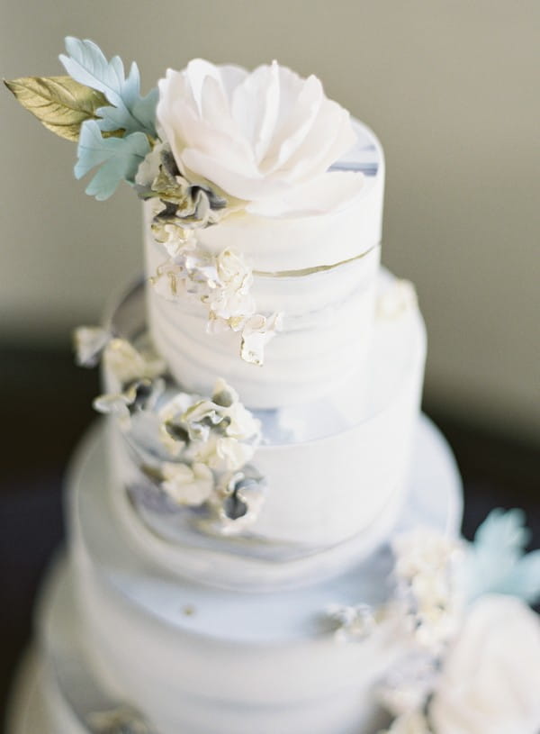 Flowers on grey marble wedding cake