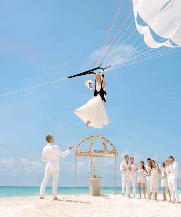 Bride Parasailing During Wedding Abroad