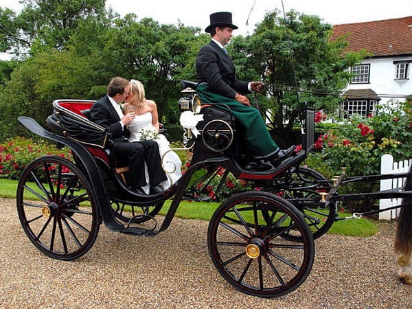 Bride and Groom in Horse-Drawn Victoria Carriage