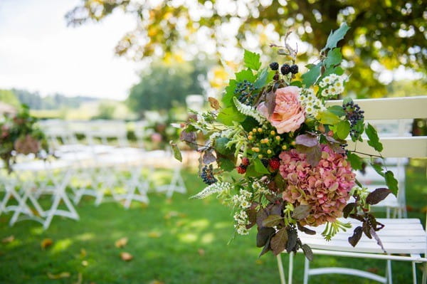 Wedding Flowers on White Folding Chair