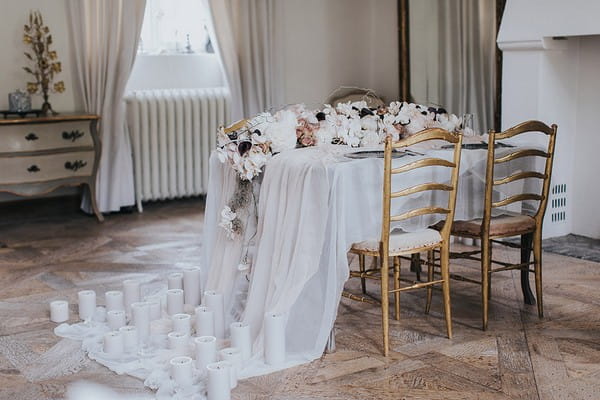 Wedding table with tulle tablecloth draped to floor