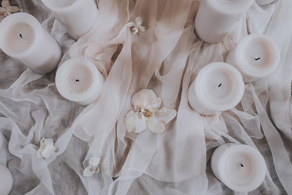 Candles on tulle tablecloth