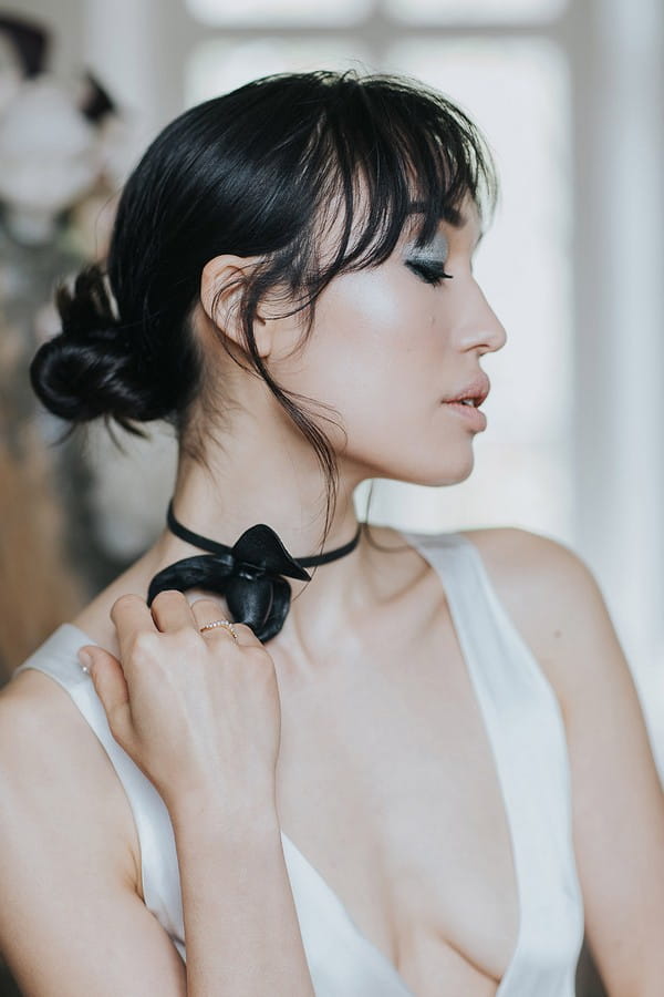 Bride with updo and dark choker neckpiece