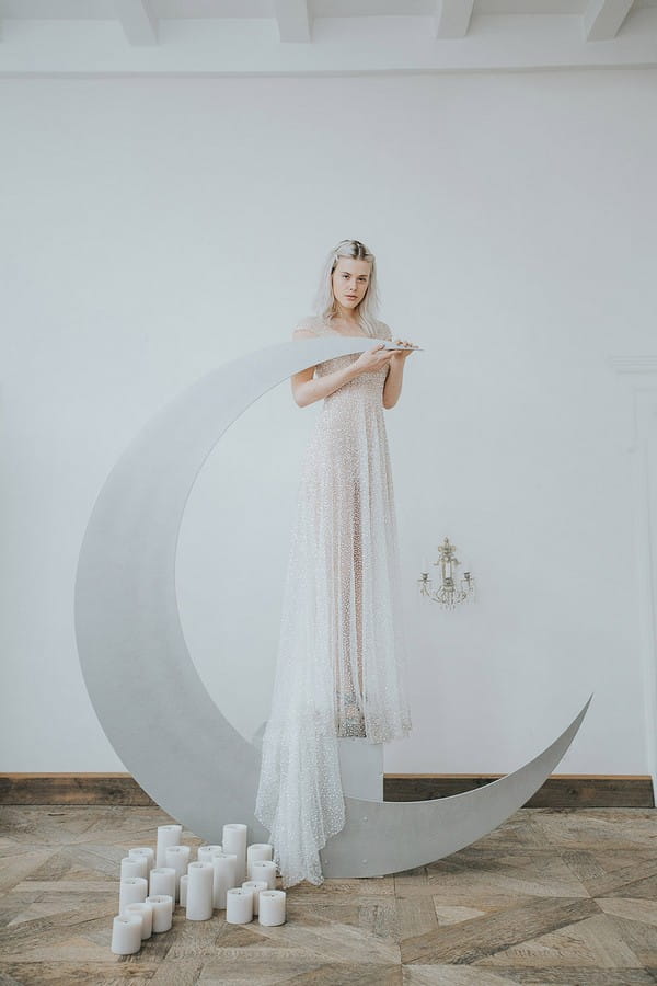 Bride standing on crescent moon
