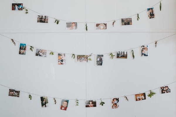 Photographs hanging from string