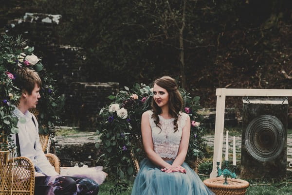 Bride sitting in outdoor seating area