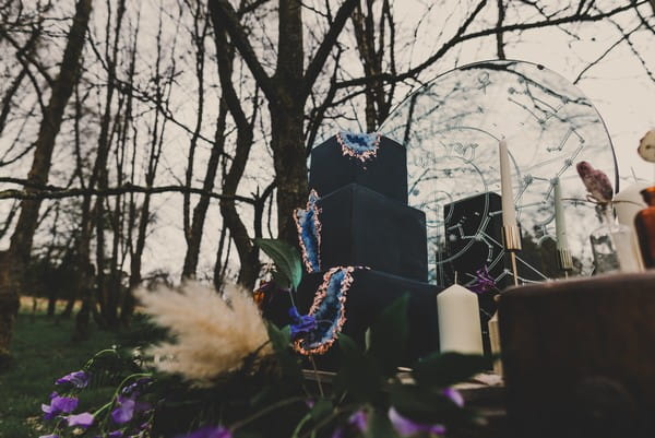 Black wedding cake with blue cut out geode detail