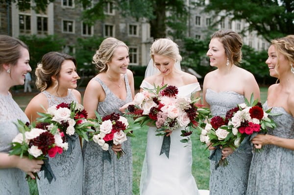 Bride with bridesmaids wearing blue grey dresses