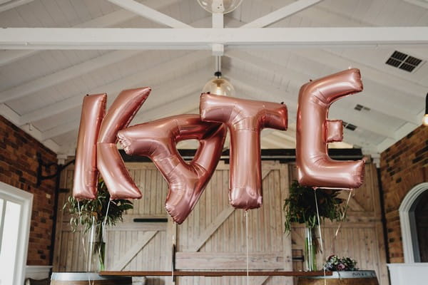 Balloons spelling out KATE