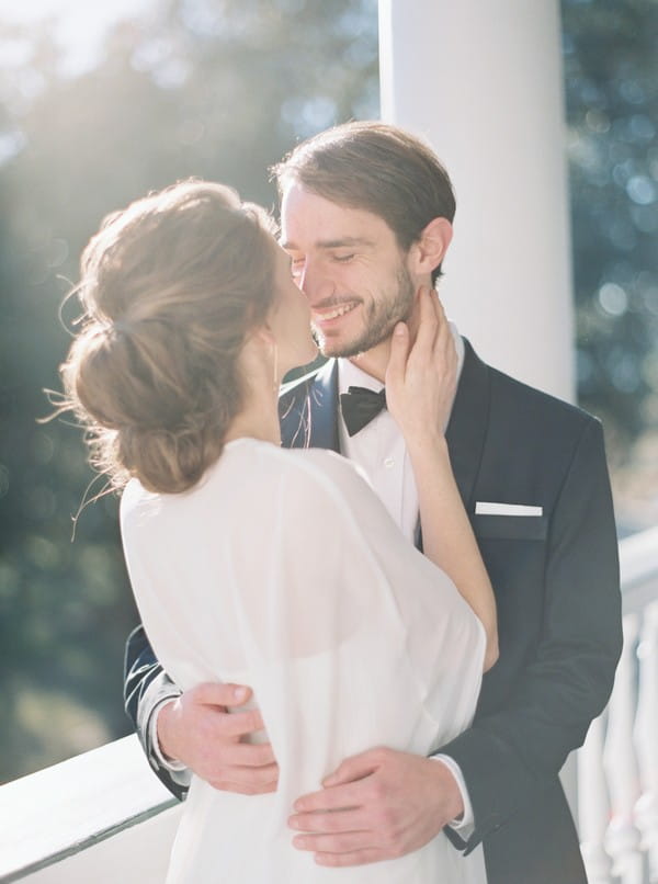 Bride and groom smiling at each other