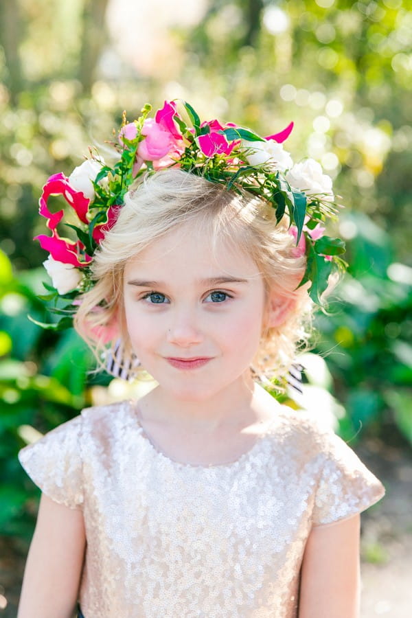 Flower girl wearing bright floral crown