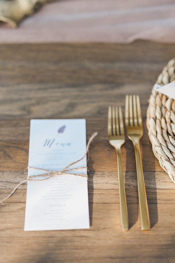 Wedding menu and gold cutlery