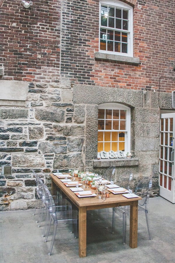 Wooden wedding table in courtyard